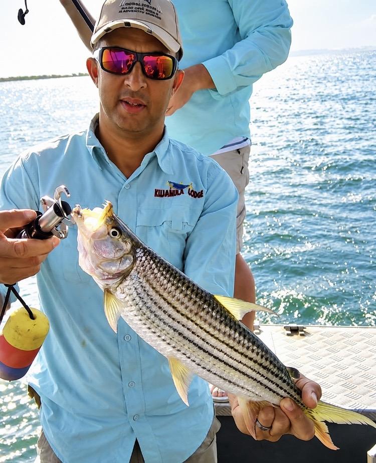 Angler holding a tiger fish caught on Lake Jozini